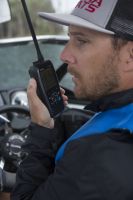 Using a handheld VHF-DSC marine band radio set to channel 16.