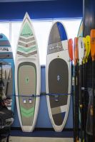 Low cost paddle craft on display in a retail outlet.