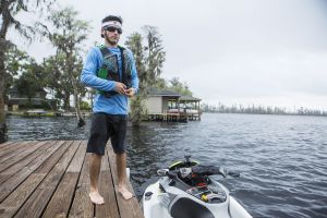 Putting a life jacket on before operating a personal watercraft.