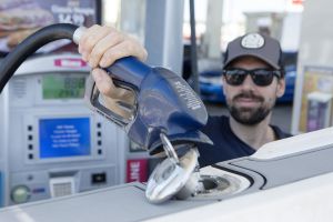 Refueling a boat at a land pump.