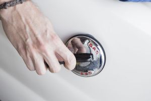 Opening a marine gas cap using a gas cap key.