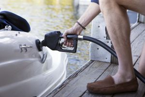 Refueling a boat at a marina pump.