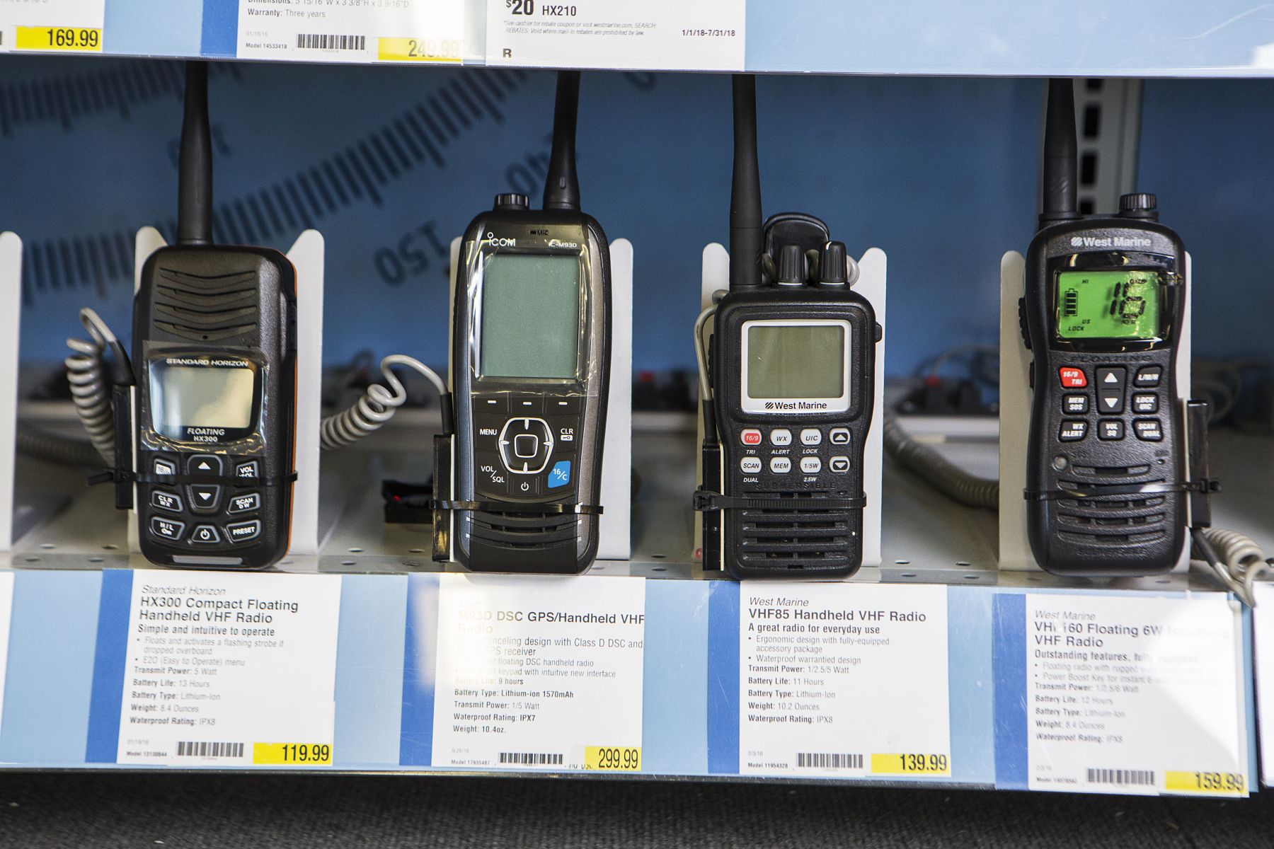 Handheld VHF radios on display at a retail outlet.