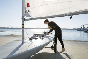 Rigging the sail while wearing a properly fitting life vest in the Sand Key inlet in Clearwater Beach.