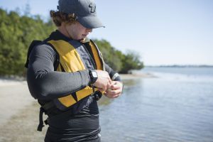 Putting on a properly fitting life vest before sailing in the Sand Key inlet in Clearwater Beach.