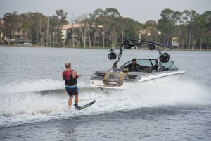 Water skiing behind a water ski boat on Lake Sheen in Orlando, Florida.