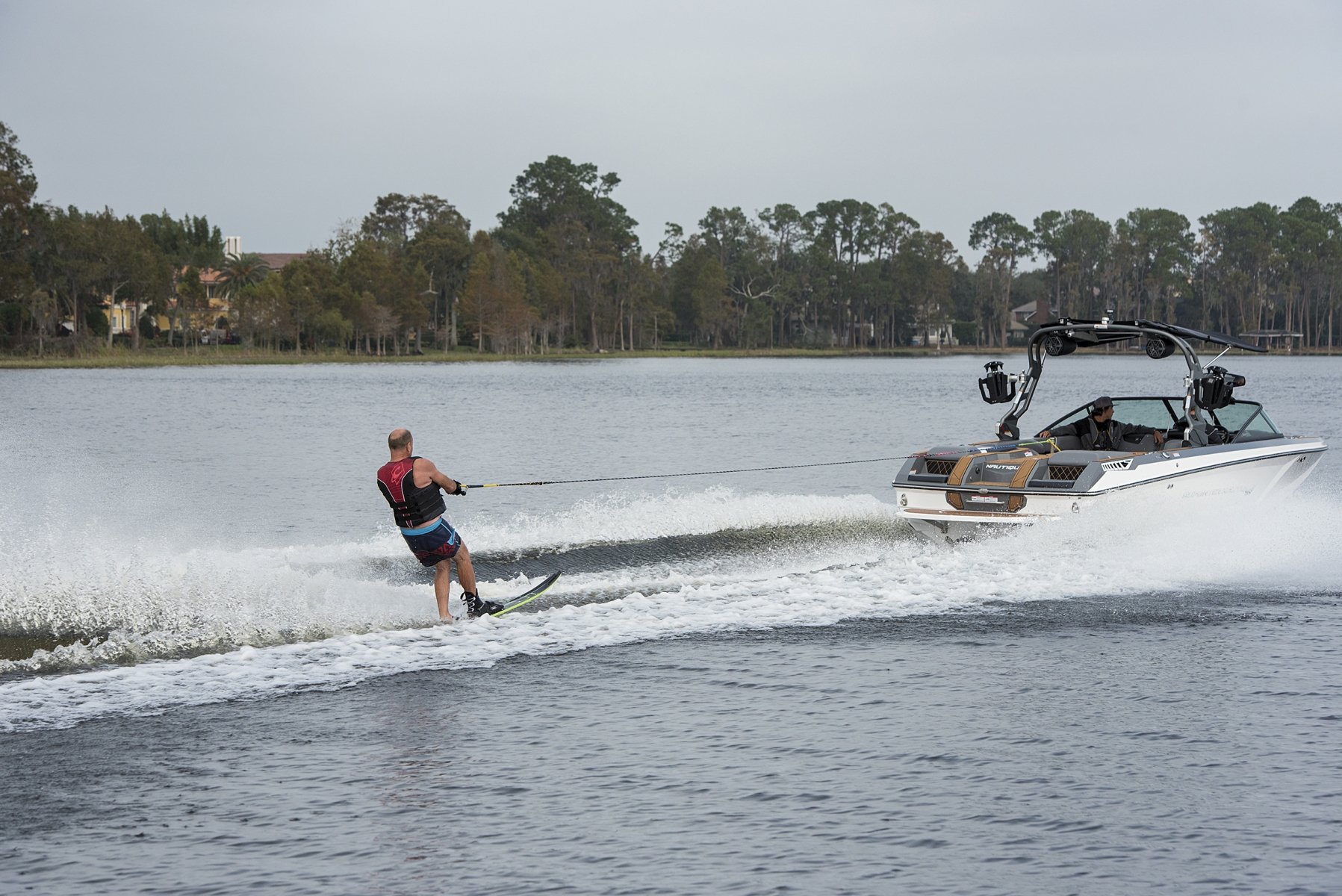Water skiing behind a water ski boat on Lake Sheen in Orlando, Florida.